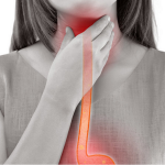 woman's hand at her throat, suggesting throat discomfort